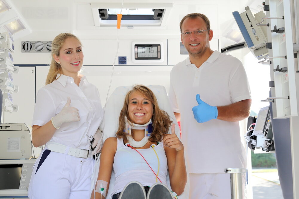medical repatriation, Medics With Female Patient In A Ambulance