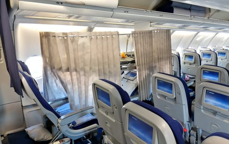 Commercial airline stretcher on plane image.